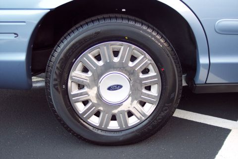 2001 Ford Crown Victoria - Front passenger side wheel and fender of a 2001 Ford Crown Victoria.