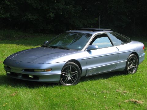 1994 Ford Probe - This 1994 Ford Probe GT is parked on a grassy lawn with trees behind it.