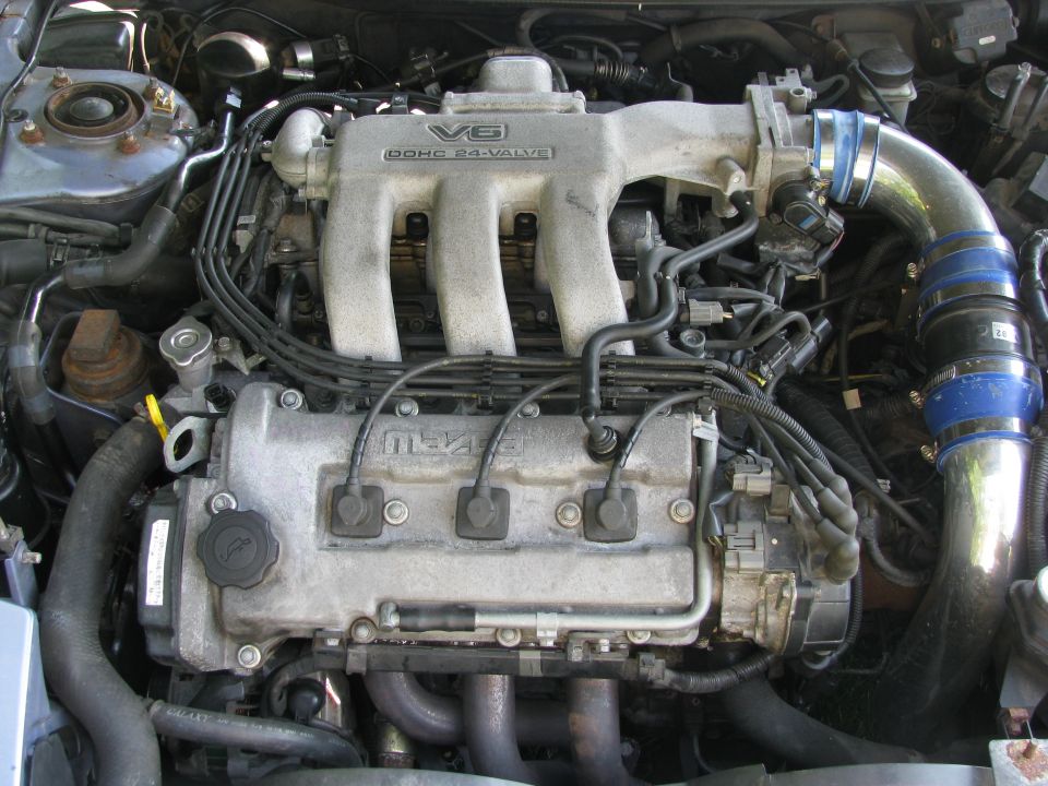 Mazda V6 DOHC 24-valve engine with aftermarket intake piping