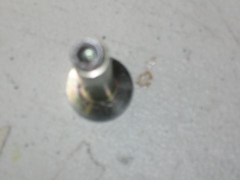 1991 Ford Bronco - A close-up view of a metal bolt, with website text in the corner.