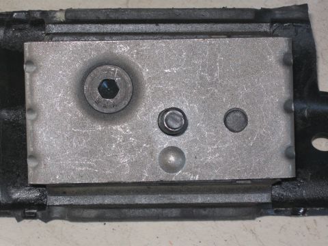 1991 Ford Bronco - Close-up view of a motor mount assembly, showing various bolts and metal plates.