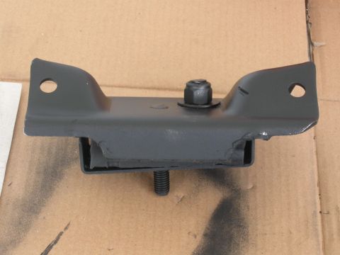 1991 Ford Bronco - A close-up view of a black engine mount with visible bolts and rubber dampening.