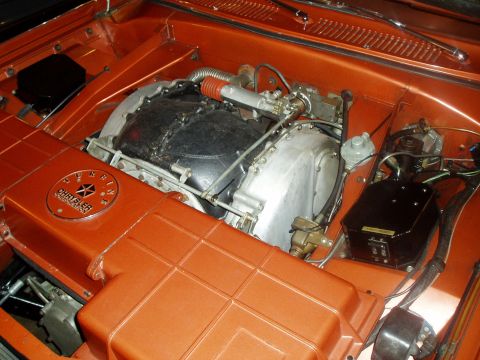 1995 Mercury Grand Marquis - Close-up of an engine bay a Chrysler Hemi engine and a distinctive circular emblem.