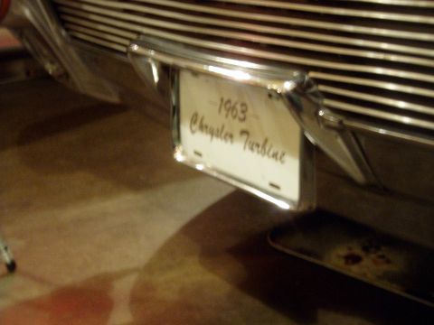 1995 Mercury Grand Marquis - A close-up view of the rear of a 1963 Chrysler Turbine, highlighting its distinctive grille and license plate.