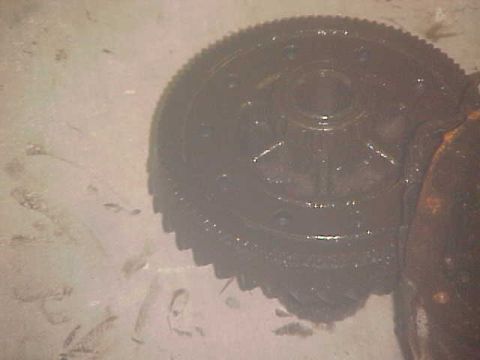 1996 Ford Bronco - A close-up view of a differential gear, with the Supermotors.net logo visible in the lower right corner.