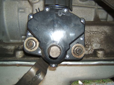 1988 Ford Bronco - Close-up of a transmission range sensor, showing its mounting bolts and electrical connector.