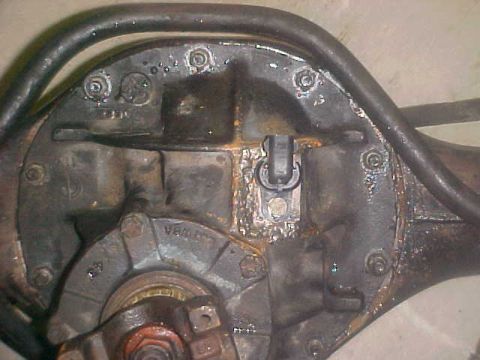 1996 Ford Bronco - Close-up of a rear axle differential, showing mechanical components and some text.