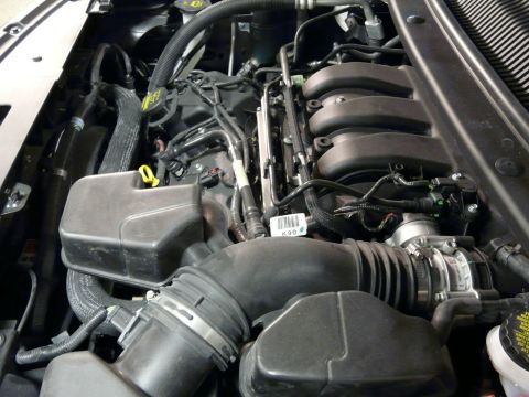 1993 Ford Taurus - Close-up view of an engine bay, showing complex mechanical components and wiring.