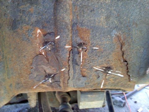 1996 Ford F-150 - ground x's on the rivets for spring buckets then chisled em off