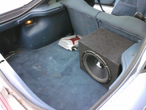 1994 Ford Probe - Subwoofer and amplifier installed in the trunk of a car.