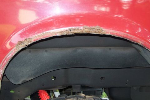 1990 Ford Bronco - Drivers side quarter panel, before repair