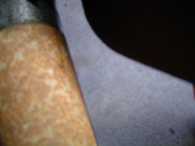 1995 Ford Bronco - Close-up of a corroded metal component, possibly from a vehicle's steering system.