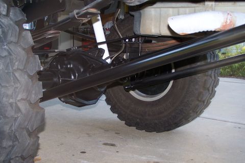 2000 Ford F-150 - Undercarriage view of a vehicle's rear suspension and axle assembly, showing heavy-duty components.