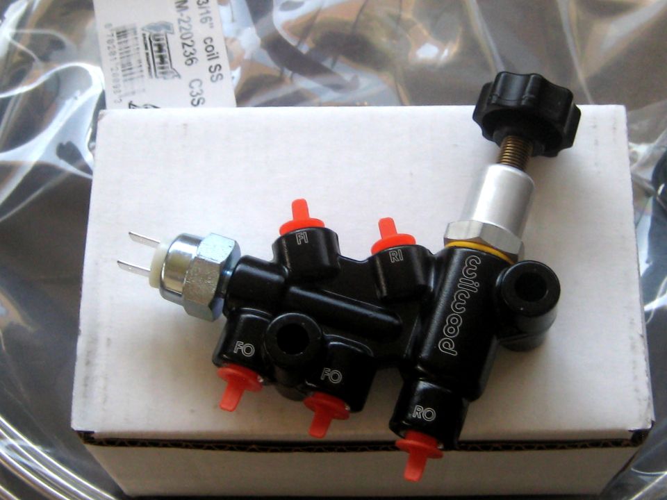 Wilwood brake proportioning valve with red caps and a black knob