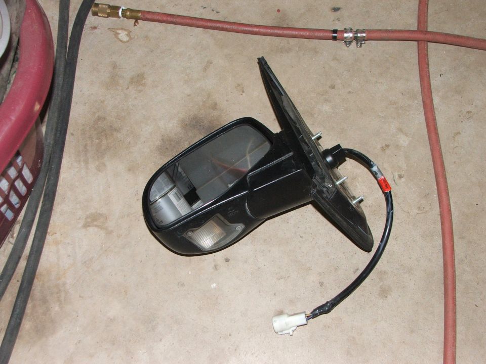 Black side mirror assembly with wiring harness disconnected