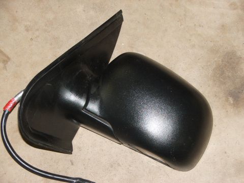 2003 Ford Sport Trac - Side mirror part shown against a concrete background.