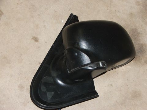 2003 Ford Sport Trac - A black side mirror is shown lying on a concrete surface. The "SUPERMOTORS.NET" watermark is visible in the lower right corner.