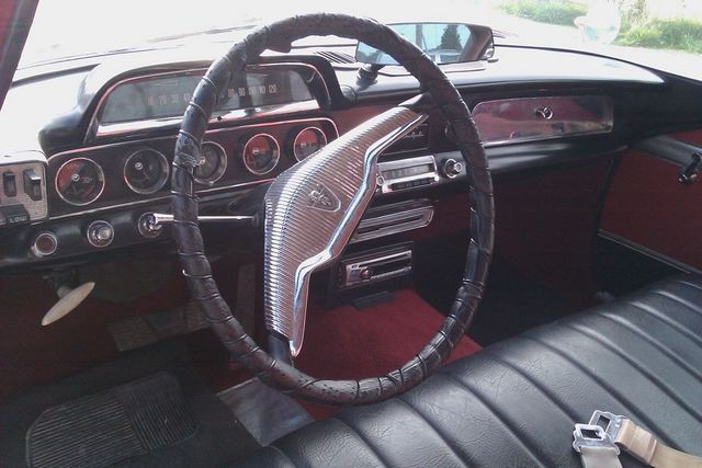 Interior dashboard with chrome accents and black steering wheel