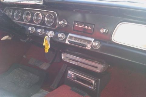 1991 Ford Crown Victoria - Interior view of a Dodge vehicle's dashboard, showing gauges and radio.