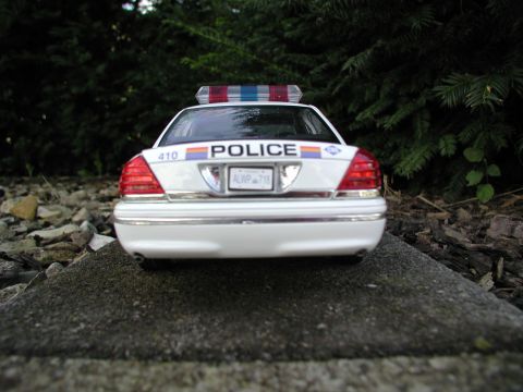 2001 Audi A4 - A police car is parked outdoors, with trees and rocks in the background.