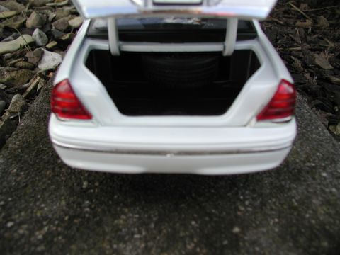 2001 Audi A4 - Rear view of a toy car's open trunk with a spare tire visible inside.