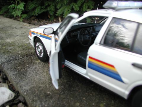 2001 Audi A4 - Model police car with 'POLICE' text and colorful side stripes.