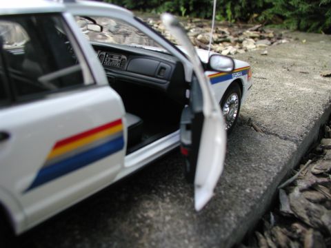 2001 Audi A4 - A close-up view of a model police car, highlighting its interior and distinctive side stripe detail.