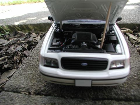 2001 Audi A4 - This 2001 Ford Crown Victoria is shown from the front with its hood open, revealing the engine compartment. The grille design is characteri…