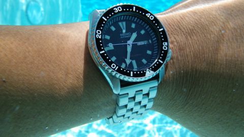 1996 Ford Bronco - Seiko automatic watch on wrist underwater, with Supermotors.net watermark.