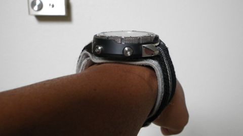 1996 Ford Bronco - A close-up view of a watch worn on a wrist against a plain background.