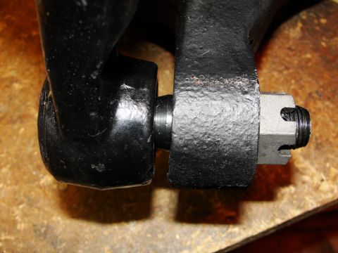 1995 Ford Bronco - A close-up view of a suspension component, highlighting the connection point secured by a castle nut.
