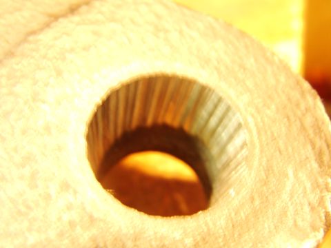 1995 Ford Bronco - A close-up view of a textured wheel hub component, revealing its internal ribbed structure.