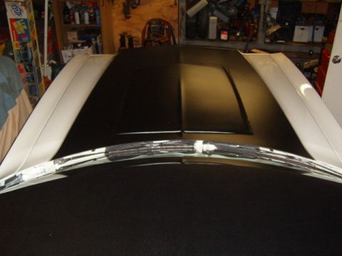 1973 Ford Ranchero - A close-up view of a 1973 Ford Ranchero's hood and windshield wipers.