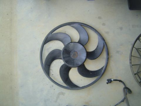 1994 Ford Crown Victoria - A radiator fan with six curved blades is shown, likely a replacement part.