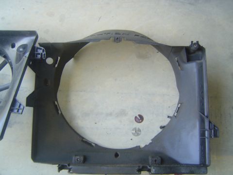 1994 Ford Crown Victoria - A black plastic radiator fan shroud is shown, with some text visible on its upper curve.