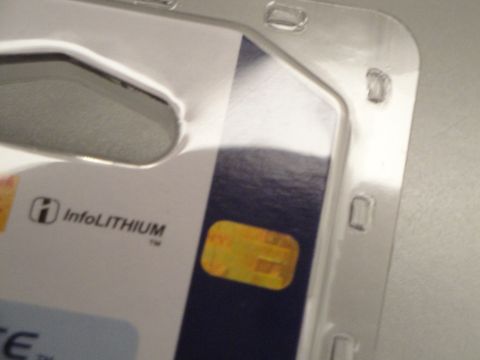 1993 Ford Taurus - Close-up of packaging for an InfoLithium product, showing text and a holographic sticker.
