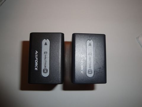 1993 Ford Taurus - Two ActiFORCE InfoLITHIUM H camera batteries are shown on a flat surface.