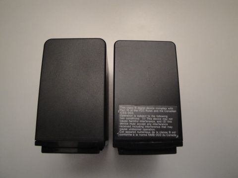 1993 Ford Taurus - Two black speakers are shown, with regulatory text visible on the side of the right speaker.