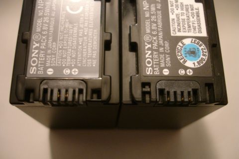 1993 Ford Taurus - Close-up view of two Sony NP-F970 battery packs, detailing their model numbers and manufacturing information.