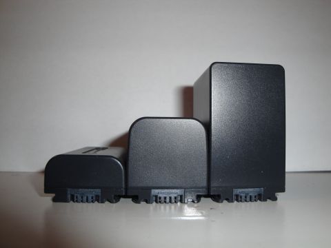 1993 Ford Taurus - Three black camera batteries, varying in size, are displayed side-by-side.