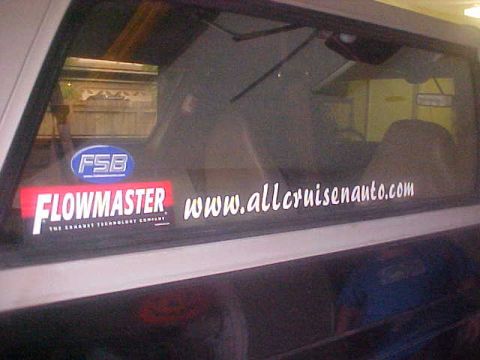 1996 Ford Bronco - Stickers on a car window include Flowmaster and a website address.