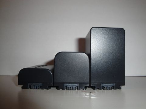 1993 Ford Taurus - Three black camera batteries are shown side-by-side, displaying different dimensions.