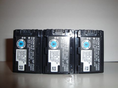 1993 Ford Taurus - Three Sony rechargeable battery packs are displayed, each with caution and recycling information printed on their labels.