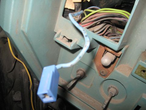 1981 Ford Bronco - Close-up view of a vehicle's interior showing a complex wiring harness and electrical components.