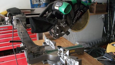 1986 Chevrolet Blazer - A Hitachi miter saw is shown in a workshop setting, with a red Snap-on tool chest in the background.