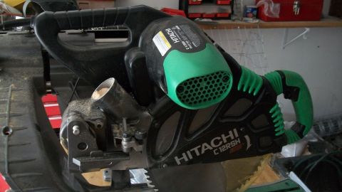 1986 Chevrolet Blazer - Hitachi C12RSH miter saw is shown with its dust collection system and handle.