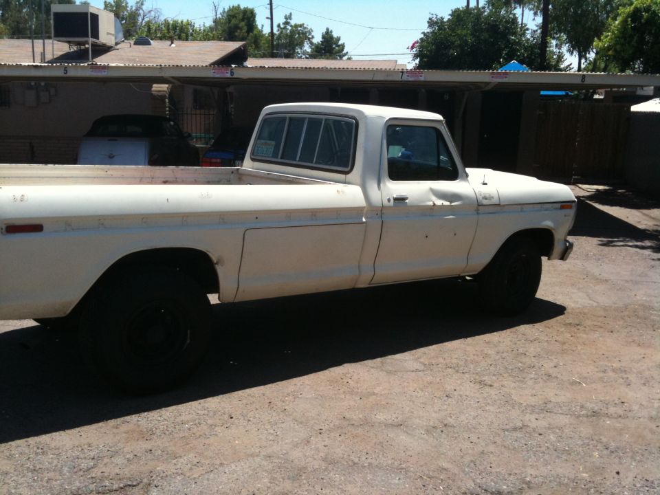 White 1979 Ford F-350 pickup truck, side view