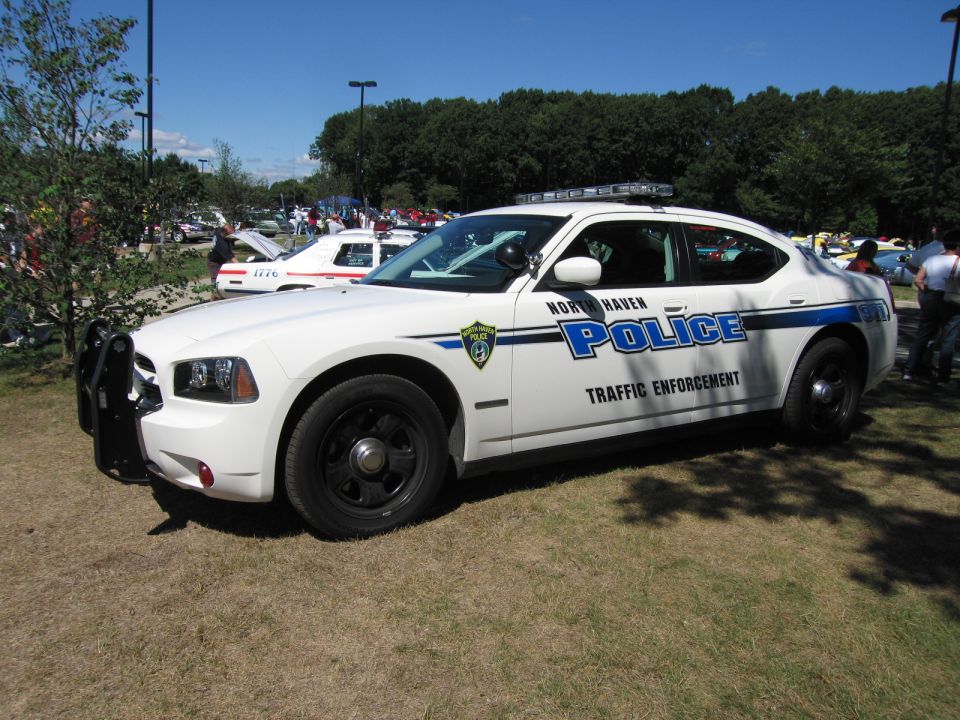 White North Haven Police Dodge Charger with green markings, side view