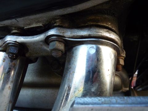 1978 Honda GL1000 - Detail shot of a motorcycle's exhaust system, showing the junction of pipes and mounting hardware.