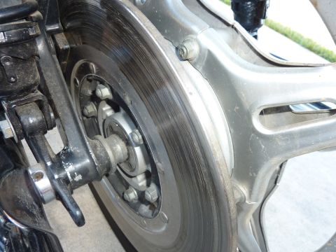 1978 Honda GL1000 - Close-up view of a motorcycle's rear brake system, showing the rotor and part of the swingarm.